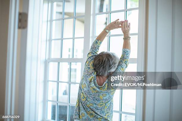 133 Woman Stretching In Front Of Window Stock Photos, High-Res Pictures ...