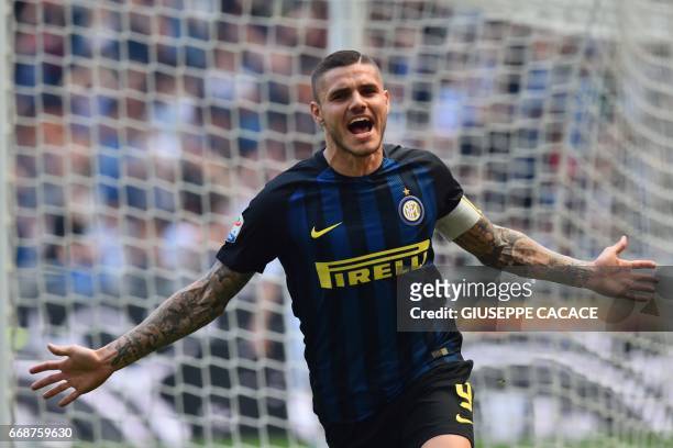 Inter Milan's forward from Argentina Mauro Icardi celebrates after scoring during the Italian Serie A football match Inter Milan vs AC Milan at the...