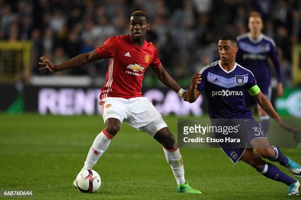 Paul Pogba of Manchester United and Youri Tielemans of Anderlecht compete for the ball during the UEFA Europa League quarter final first leg match...