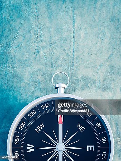 compass on blue background - compass north stock illustrations