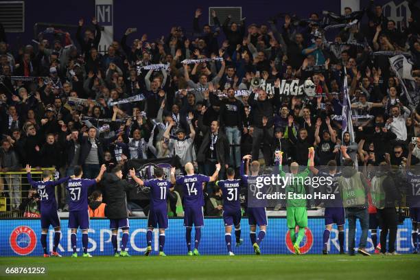 Anderlecht players applaud supporters after the 1-1 draw in the UEFA Europa League quarter final first leg match between RSC Anderlecht and...