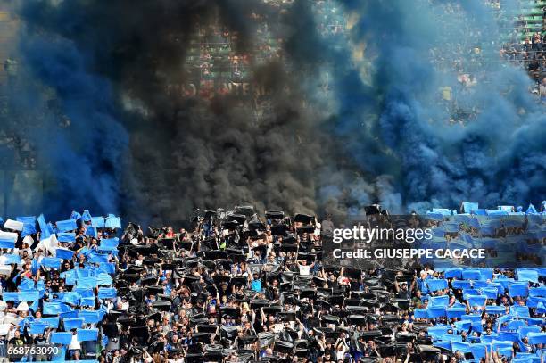 Inter Milan's supporters cheer their team prior the Italian Serie A football match Inter Milan vs AC Milan at the San Siro stadium in Milan on April...