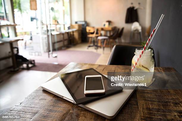 Mobile devices on table in a cafe