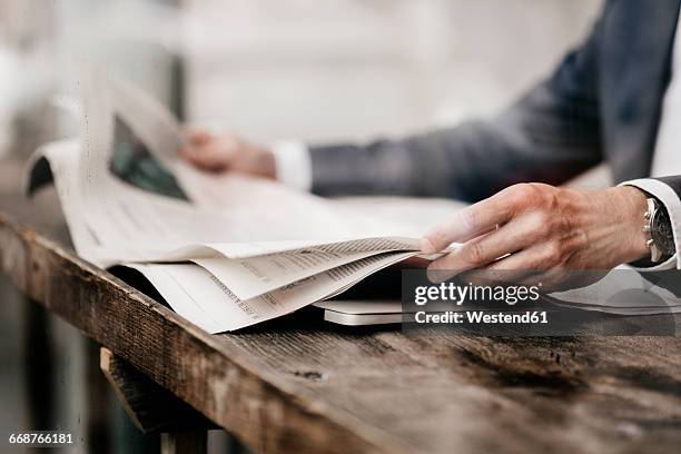 businessman in cafe reading newspaper - publish stock pictures, royalty-free photos & images