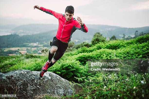 trail runner man training in nature in the evening - sportsman stock pictures, royalty-free photos & images