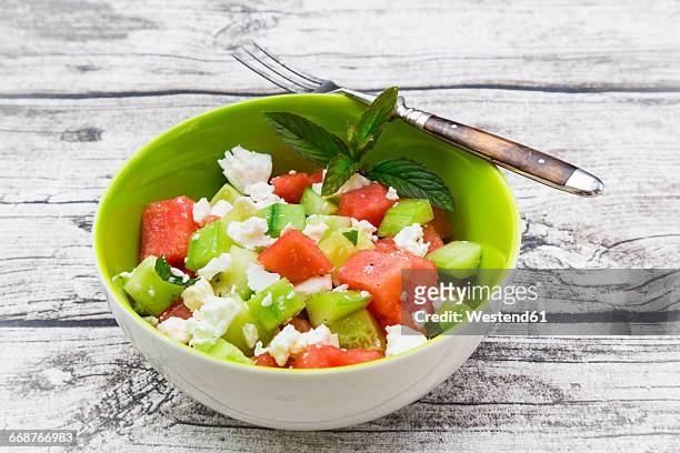 bowl of salad with watermelon, cucumber, mint and feta - feta cheese stock pictures, royalty-free photos & images