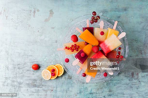 fruits and different homemade ice lollies made of fruit juice and pulp - fruktkött bildbanksfoton och bilder