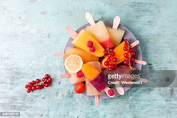fruits and different homemade ice lollies made of fruit juice and pulp - fruktkött bildbanksfoton och bilder
