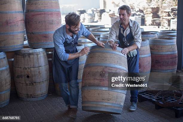 south africa, cooper rolling wine barrel - rollup photos et images de collection