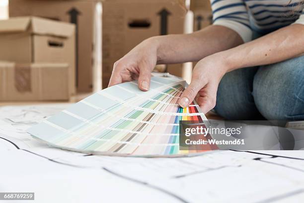 woman with color samples on floor - shaping future stock-fotos und bilder