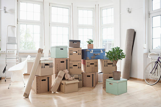 Where to Buy Moving Boxes in South Africa? 5 stack of cardboard boxes in empty apartment