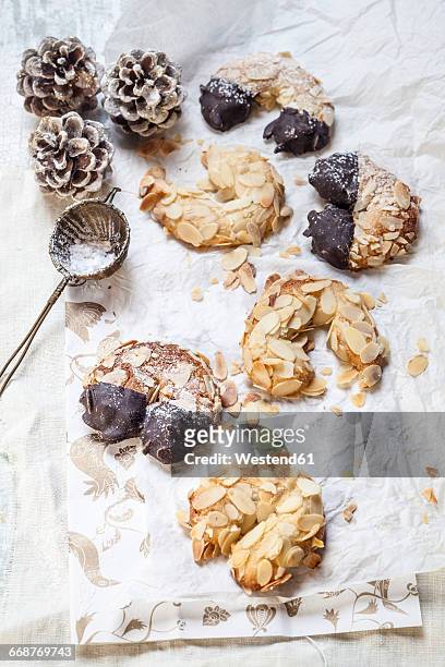 home-baked christmas cookies, almond crescents with powdered sugar - almond cookies stock pictures, royalty-free photos & images