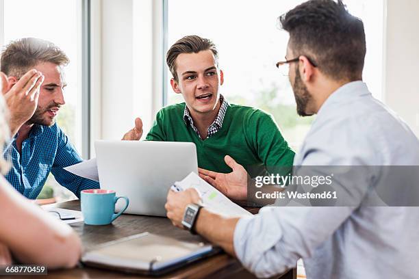 young professionals arguing in office - disagreement at work stock pictures, royalty-free photos & images