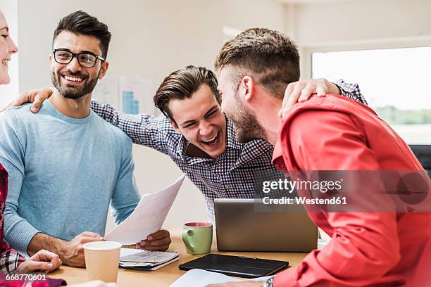 laughing young professionals in office - facial expression girl office stock pictures, royalty-free photos & images