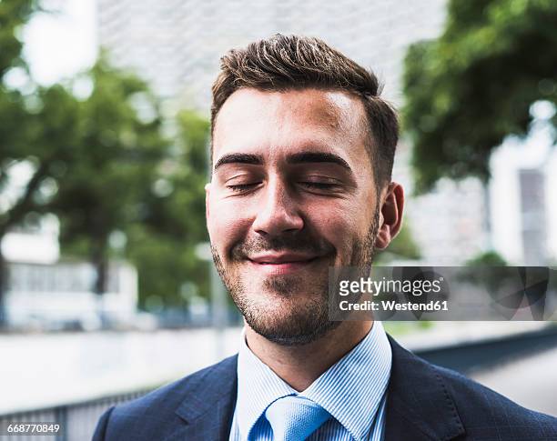 portrait of a young businessman - indulgence stock pictures, royalty-free photos & images