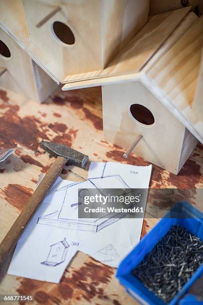 top view of tools and plan laid out of birdhouse in workshop - birdhouse stock pictures, royalty-free photos & images