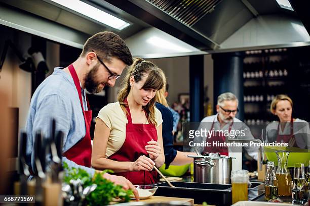 chef assisting a cooking class - cookery class stock pictures, royalty-free photos & images