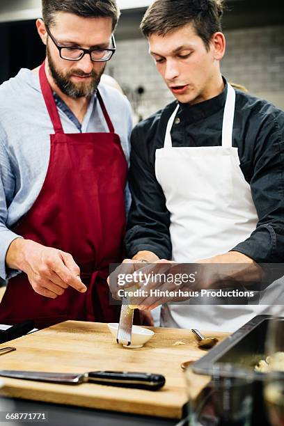 Chef explaining how to shred cheese