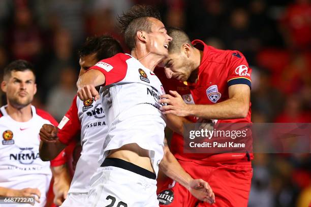 Ryan Griffiths of the Wanderers and Iacopo La Rocca of Adelaide clash heads during the round 27 A-League match between Adelaide United and the...