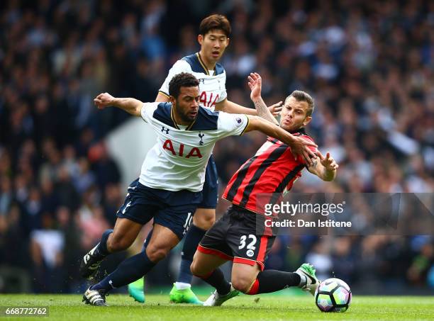 Mousa Dembele of Tottenham Hotspur and Jack Wilshere of AFC Bournemouth battle for possession during the Premier League match between Tottenham...