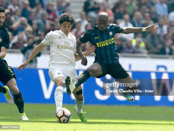 Geoffrey Kondogbia of FC Internazionale competes for the ball with Matias Fernandez of AC Milan during the Serie A match between FC Internazionale...