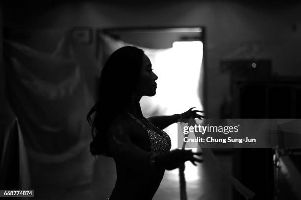 Female bodybuilder prepares herself for judging backstage during the 2017 NABBA WFF Asia Seoul Open Championship on April 15, 2017 in Seoul, South...