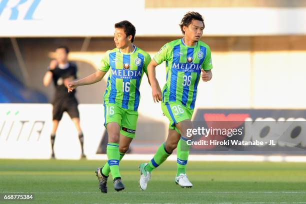 Takuya Okamoto of Shonan Bellmare celebrates scoring his side's second goal with his team mate Mitsuki Saito during the J.League J2 match between...
