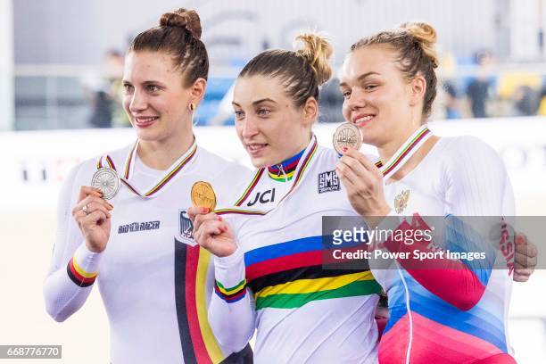 Daria Shmeleva of Russia celebrates winning in the Women's 500 TT Finals' prize ceremony with Miriam Welte of Germany and Anastasiia Voinova of...
