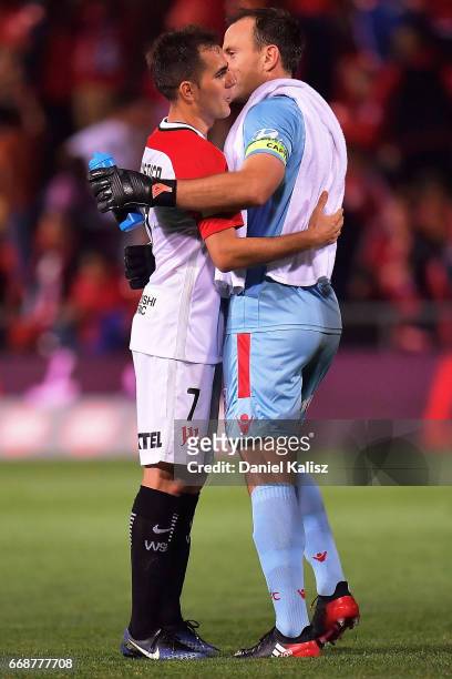 Steve Lustica of the Wanderers congratulates United goalkeeper Eugene Galekovic during the round 27 A-League match between Adelaide United and the...