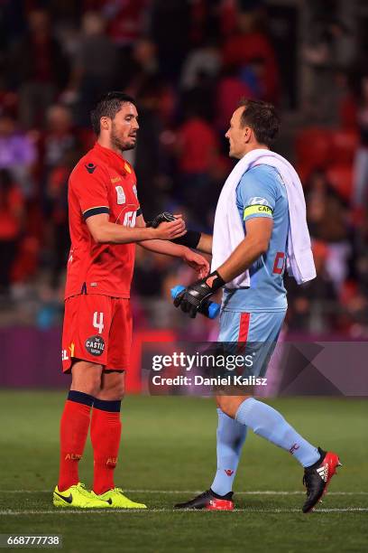 Dylan McGowan of United reacts with United goalkeeper Eugene Galekovic during the round 27 A-League match between Adelaide United and the Western...
