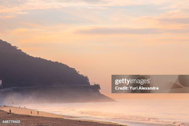 sunrise in sao conrado beach waterfront, rio de janeiro - sao conrado beach stock pictures, royalty-free photos & images