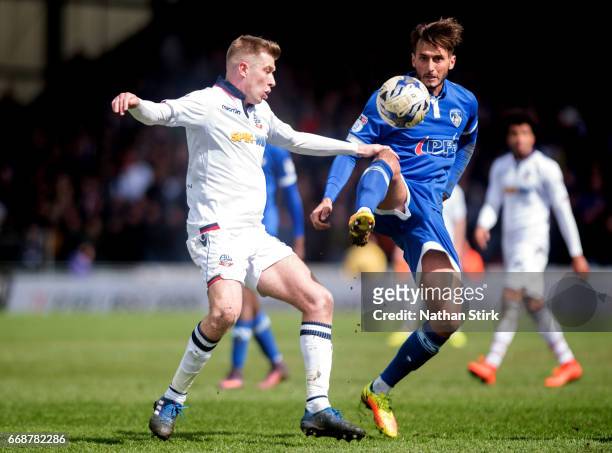 Oliver Banks of Oldham Athletic and Josh Vela of Bolton Wanderers in action during the Sky Bet League One match between Oldham Athletic and Bolton...