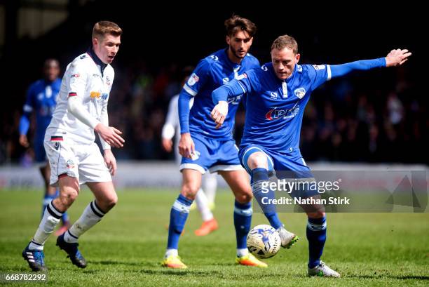 Brian Wilson of Oldham Athletic and Josh Vela of Bolton Wanderers in action during the Sky Bet League One match between Oldham Athletic and Bolton...