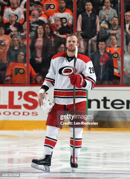 Bryan Bickell of the Carolina Hurricanes stands on the blue line during the National Anthem prior to the start of his game against the Philadelphia...