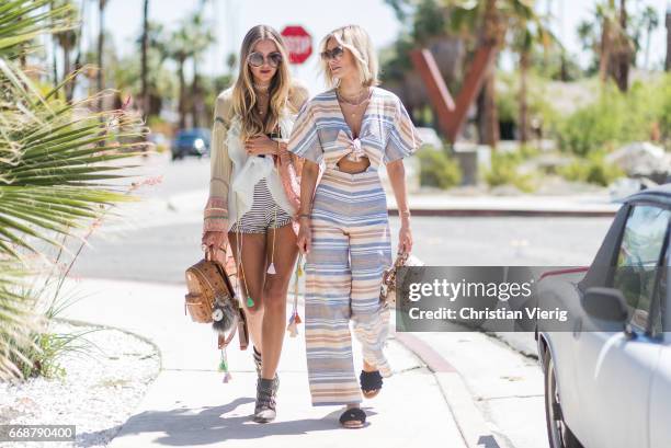 Lisa Hahnbueck wearing solid and striped jumpsuit, Max&co fringe sandals, MCM x-mini backpack Fendi sunglasses and Nina Suess wearing Chloe top,...