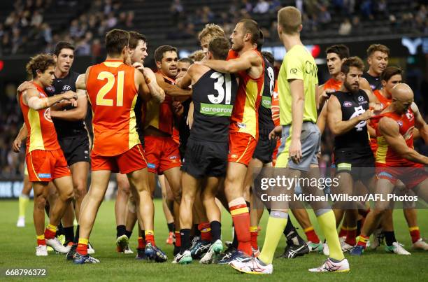 Players wrestle during the 2017 AFL round 04 match between the Carlton Blues and the Gold Coast Suns at Etihad Stadium on April 15, 2017 in...