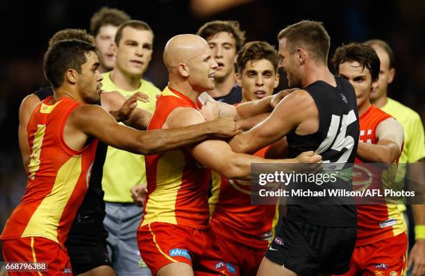 Gary Ablett of the Suns and Sam Docherty of the Blues wrestle during the 2017 AFL round 04 match between the Carlton Blues and the Gold Coast Suns at...