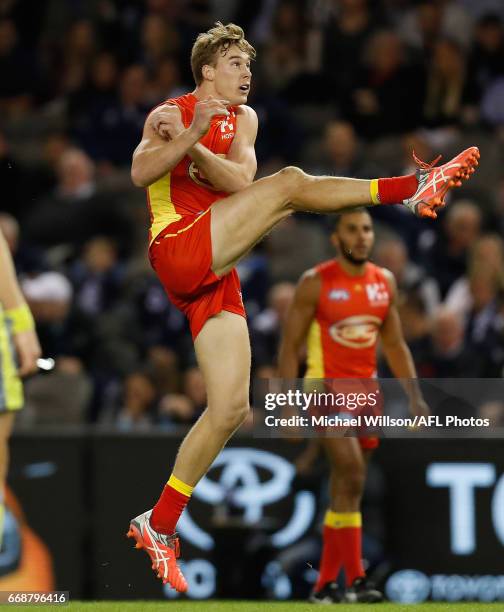 Tom Lynch of the Suns kicks a goal during the 2017 AFL round 04 match between the Carlton Blues and the Gold Coast Suns at Etihad Stadium on April...