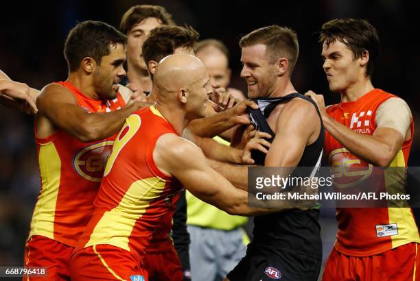 Gary Ablett of the Suns and Sam Docherty of the Blues wrestle during the 2017 AFL round 04 match between the Carlton Blues and the Gold Coast Suns at...