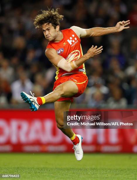 Jarrod Harbrow of the Suns kicks the ball during the 2017 AFL round 04 match between the Carlton Blues and the Gold Coast Suns at Etihad Stadium on...