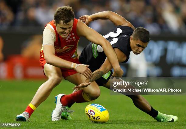 Jarrod Pickett of the Blues and Kade Kolodjashnij of the Suns in action during the 2017 AFL round 04 match between the Carlton Blues and the Gold...