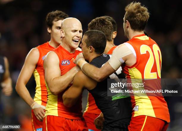 Gary Ablett of the Suns and Ed Curnow of the Blues wrestle during the 2017 AFL round 04 match between the Carlton Blues and the Gold Coast Suns at...