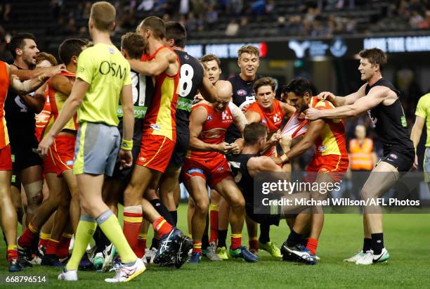 Players wrestle during the 2017 AFL round 04 match between the Carlton Blues and the Gold Coast Suns at Etihad Stadium on April 15, 2017 in...