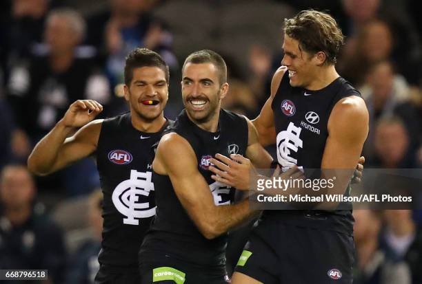 Sam Petrevski-Seton, Kade Simpson and Charlie Curnow of the Blues celebrate during the 2017 AFL round 04 match between the Carlton Blues and the Gold...
