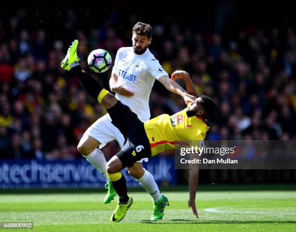 Fernando Llorente of Swansea City and Adrian Mariappa of Watford battle for possession during the Premier League match between Watford and Swansea...