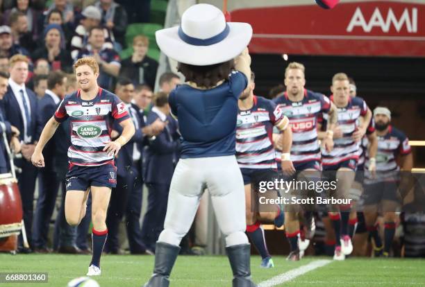 Nic Stirzaker of the Rebels leads his side onto the field during the round eight Super Rugby match between the Rebels and the Brumbies at AAMI Park...