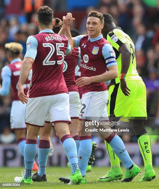 James Chester of Aston Villa celebrates his goal with team mate Mile Jedinak during the Sky Bet Championship match between Aston Villa and Reading at...