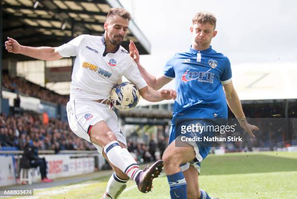 Filipe Morais of Bolton Wanderers and Jamie Stott of Oldham Athletic in action during the Sky Bet League One match between Oldham Athletic and Bolton...
