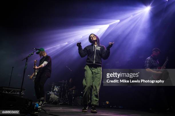 Cam Adler and Jenna McDougall of Tonight alive performs on stage at Motorpoint Arena on April 14, 2017 in Cardiff, United Kingdom.