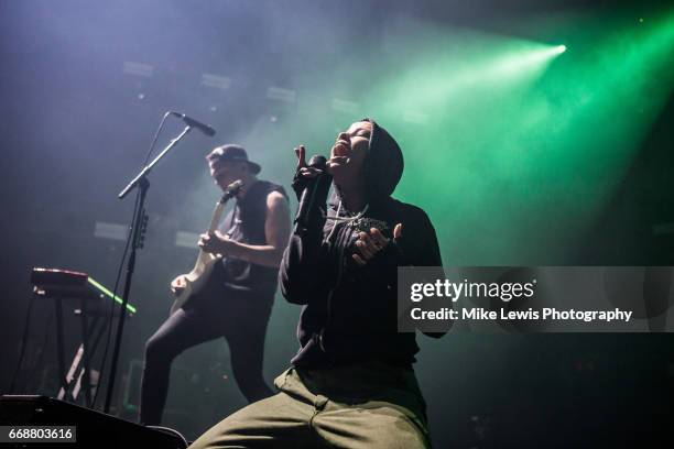 Whakaio Taahi and Jenna McDougall of Tonight alive performs on stage at Motorpoint Arena on April 14, 2017 in Cardiff, United Kingdom.